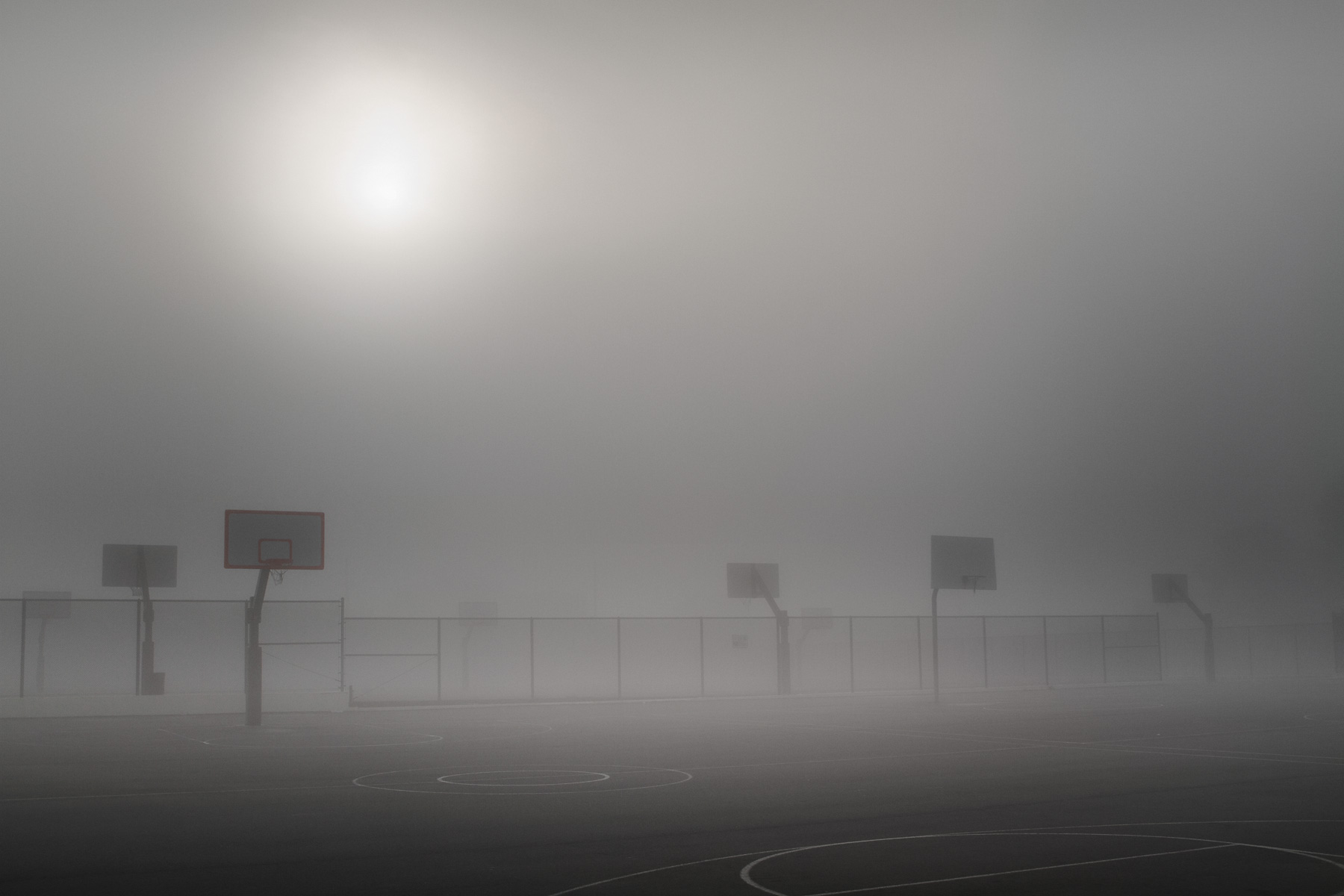 Stephen Austin Welch commercial director & advertising and fine art landscape photographer basketball courts in fog B&W black and white sepia selenium duo-toned photography: moody and dramatic fine art photographs
