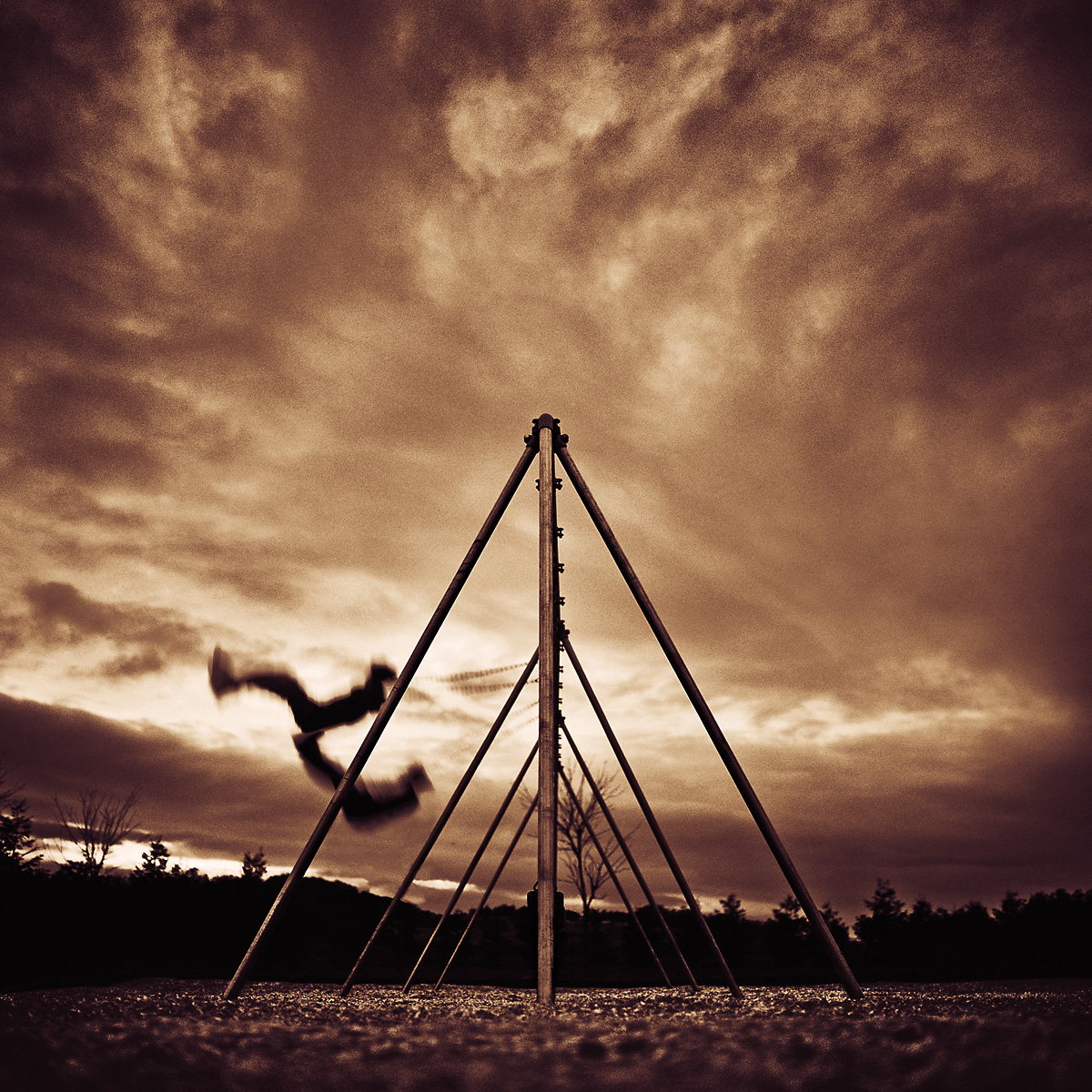 Stephen Austin Welch advertising fine art landscape photographer boys on swings B&W black and white moody dramatic photograph